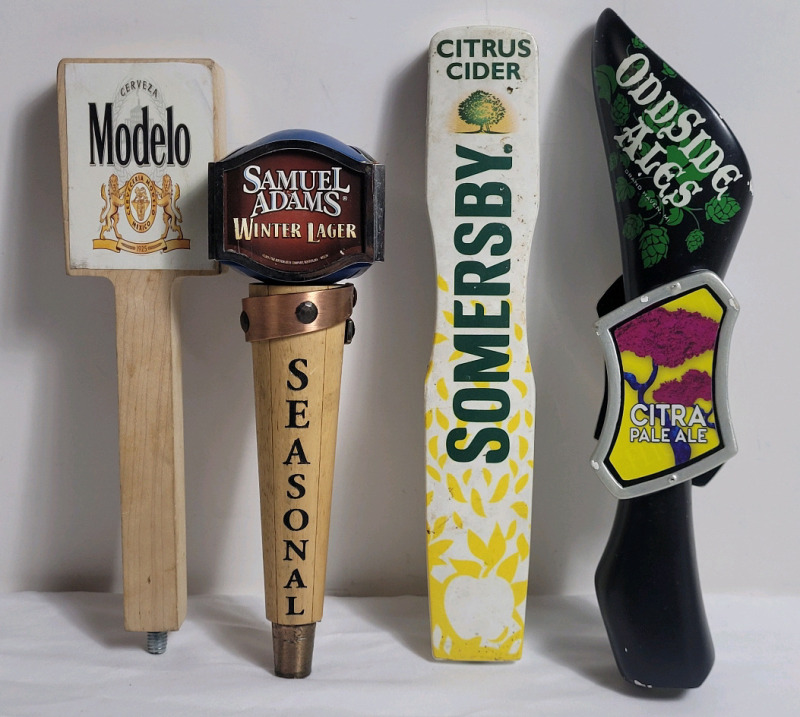 Four (4) Bar Beer Taps . Modelo , Samuel Adam's Winter Lager , Somersby Cider & Oddside Ales . Measures 9.5" to 12" tall
