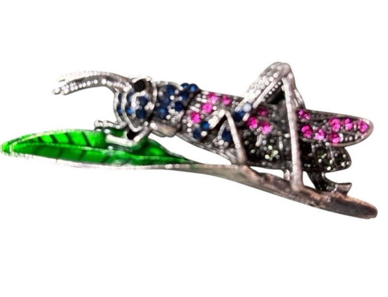 Elegant Rhinestone Insect Brooch Grasshopper Detailed Resting on Enamel Green Leaf<br/>Approximately 2.5 x .9 Inch