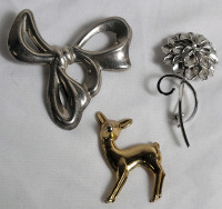 Three (3) Sterling Silver Brooches . See photos for size