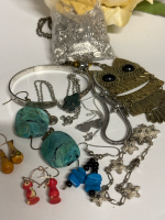 Assortment of Earrings Cuff Bracelet Charn Bracelet Gnoce and Owl Necklace Bag DOrlan Findings see description