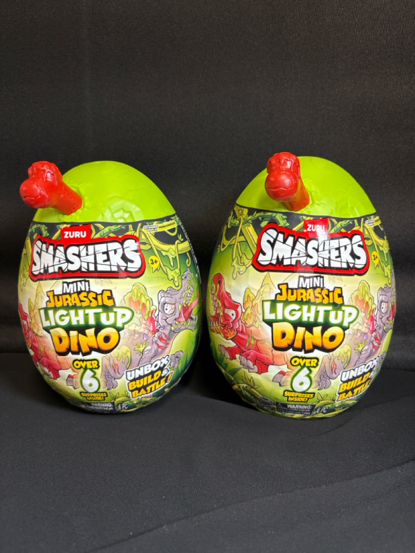 2 New | ZURU Smashers| Mini Jurassic Lightup Dino Over 6 Surprises inside