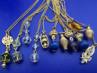 12 Vintage Necklaces on original Ring hook.