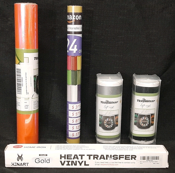Lot of Vinyl Wrap Products | Includes Xenart Gold 12"&times;8ft Heat Transfer Vinyl Wrap, TeckWrap Coral Orange 1ft&times;5ft Holographic Chrome Vinyl Wrap, 2 Teckwrap Matte Black 5"&times;10ft Adhesive Decal Rolls & Generic Gold Heat Transfer Vinyl Wrap (At Least 1ft, Un