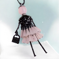 Bohemian Long Chain Necklace with Acrylic Layered Ruffled Pendant & Rose Quartz Accents Coloured Head Black Top + Chain. Approximately 3.5 x1.5 inch 24in double chain