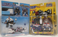 2 Startimg Lineup Collectables | Starting Lineup set featuring action figures of goalies Olaf Kolzig and Patrick Roy & 1998 Starting Lineup Classic Doubles action figure set featuring hockey players Patrick Roy and John LeClair | Ea. Measures 10" x 12"