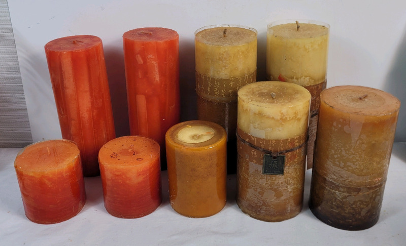 9 New Old Stock Various Size Scented " Pillar Candles " . Apricot Ginger & Unknown Scent . Candles measure 3" to 7 1/4" tall