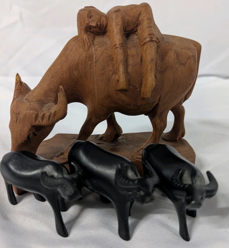4 Buffalo Figures. Tallest Made of Wood and Measures 4" Tall.