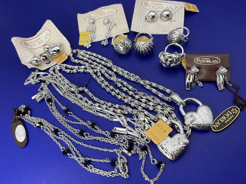 Vintage D&rsquo;Orlan two signed etched hearts on chunky 24&rsquo;&rsquo; chains. Two signed chains with faceted black stones with one at 24&rsquo;&rsquo; and one 28&rsquo;&rsquo; Four silver scarf clips all with a different motif. Marinar link and chain drop silver demure clip on earrings. Sign