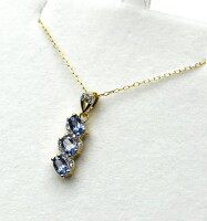 NEW Gold Plated Sterling Silver Natural Tanzanite (0.75ct) and CZ (0.10ct) Pendant with Gold Plated Sterling Silver Chain, W/A (with appraisal) $450.00. Tanzanite is the birthstone for December.