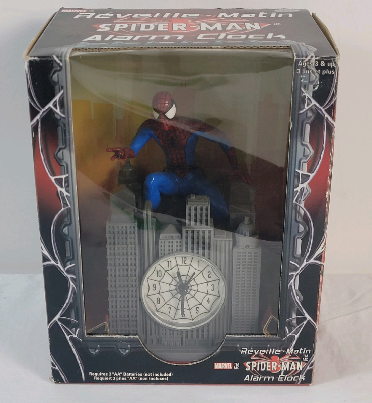 2002 Marvel Spider-Man Alarm Clock in Original Box . Measures 7" tall , requires 3 AA Batteries .