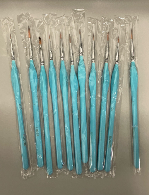 11 New wood-handled, fine tip artist brushes. Approximately 8&rdquo; tip to tip.