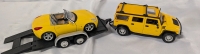 2 Diecast Cars with Trailer. 2006 Pontiac Solstice (1/24 Scale) & a Hummer (1/27 Scale)