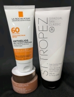 [See Desc] 3 Skincare Products: LA ROCHE-POSAY Broad Spectrum 60SPF Anthelios Melt-In Milk Sunscreen, CLARINS Extra-Firming Cream, ST TROPEZ Gradual Tan Classic Daily Firming Lotion.