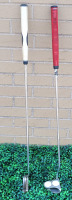 Two (2) Right Handed Odyssey Putters . 2-Ball White Hot & Tri-Hot #2 . Both Putters measure 35" long .