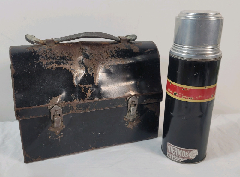 Vintage Dome Top Steel Lunch Box w/Thermos . Lunch Box has age appropriate wear & Thermos is missing inner cap . Both Made in Canada