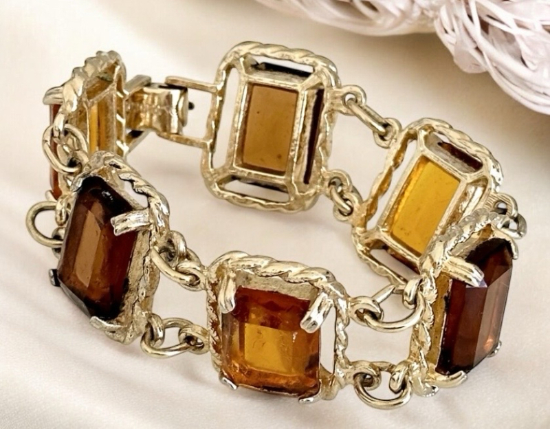 Vintage Sarah Coventry 1970 'Wild and Honey &lsquo;&rsquo; Amber Topaz Emerald Cut cut Rhinestone Bracelet in great vintage condition measuring 7 inches x 1 inch Wide Signedat Back and Fild Over Clasp Substantial