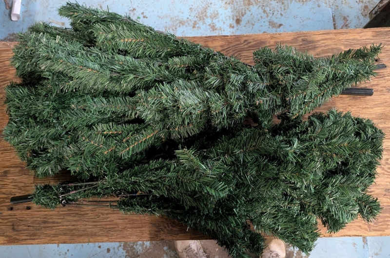 6.5' Tall Artificial Christmas Tree. Comes with Base, Ornaments and Strand of Lights.