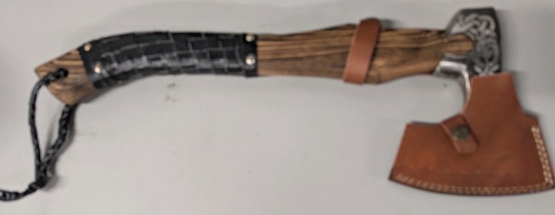 As New Hatchet with Leather Like Cover. Some Pattern Wear and Light Rust spots on Axe Head.