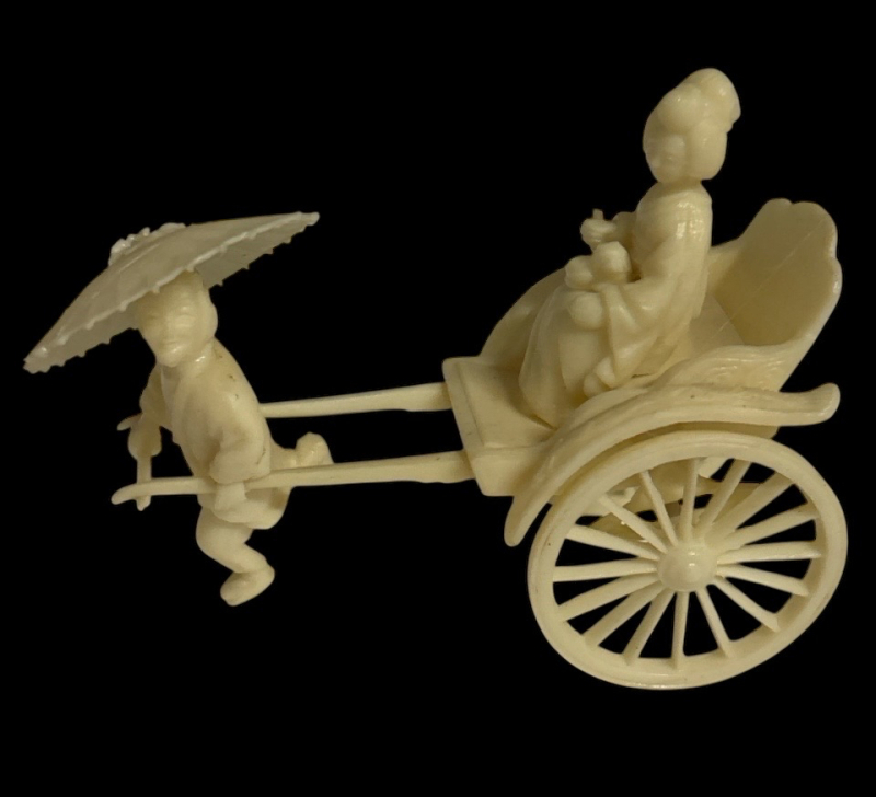 Vintage Celluloid Japanese Rickshaw Figure with Geisha in Cart likely from the Early 20th Century specifically the 1930s Approximately 3.25 x 4 inch