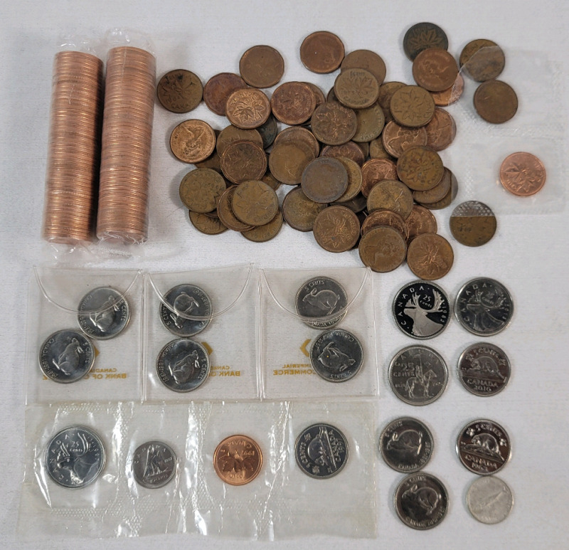 Canadian Coin Lot . Includes : 1967 Silver Dime , Two (2) Rolls 1999 Uncirculated Pennies plus various Quarters , Nickels & Pennies