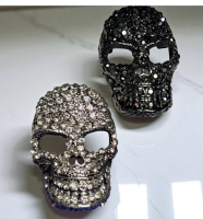 Two Fabulous Rhinestone Domed Skull Brooches 1 Clear 1 Glistening Black approximately 1.5 inch each