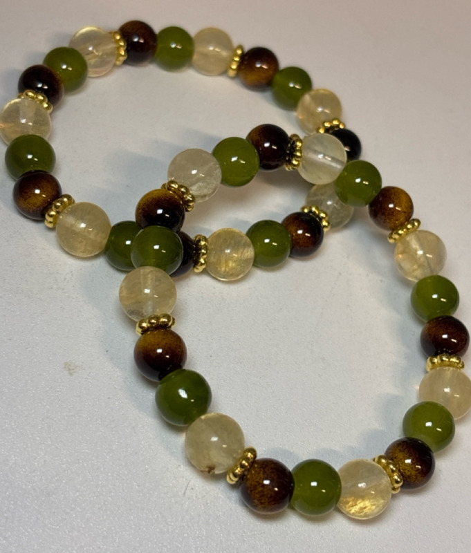 Two Natural Flex Stone Smoky Quartz And Tiger Eye Stone Woven Bracelet Stock photo added