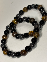 Two Flex Triple Protection Bracelets Obsidian ProHematite Tiger's Eye and Obsidian Bangle Stock photo added