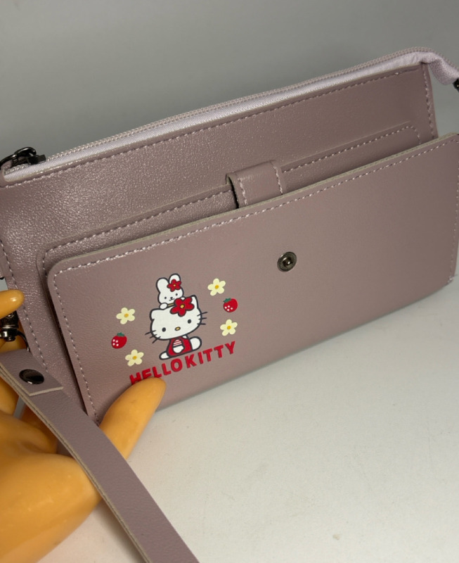Hello Kitty Wallet Sanrio Hello Red Bow Design, Spacious Foldable Zippered Coin Purse Multiple Card Slots & Wristlet Approximately 8 x 4.25 Inch