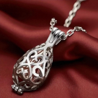 Stainless Steel Cremation Urn Necklace with Intricate Teardrop Design Cut Work Flower Keepsake Pendant for Ashes Memorial Elegant Urn Design Durable Chain Necklace Tools included Pendant 1 in Chain 21 in