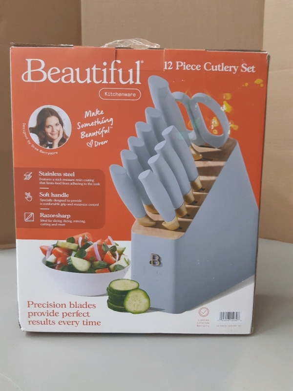 New Beautiful 12 piece Cutlery Set includes chef knife, serrated utility knife serrated santoku knife, paring knife, six steak knives All purpose shears, wood block retails $79