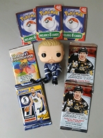 Seven collectibles: 3 Pokemon card repacks, 4 Upper deck and Donruss sport card packs, one Steve Stamkos bobblehead