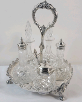 James Dixon & Sons 5pc. Crystal & Silverplate Cruet Set . Small Chip on one glass stopper