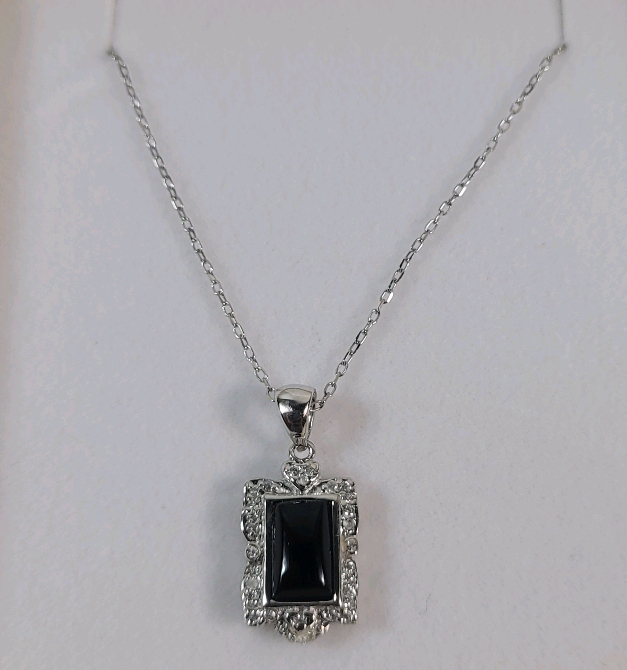 Sterling Silver Black Onyx and CZ Pendant with Sterling Silver Chain, Retail $200.00.