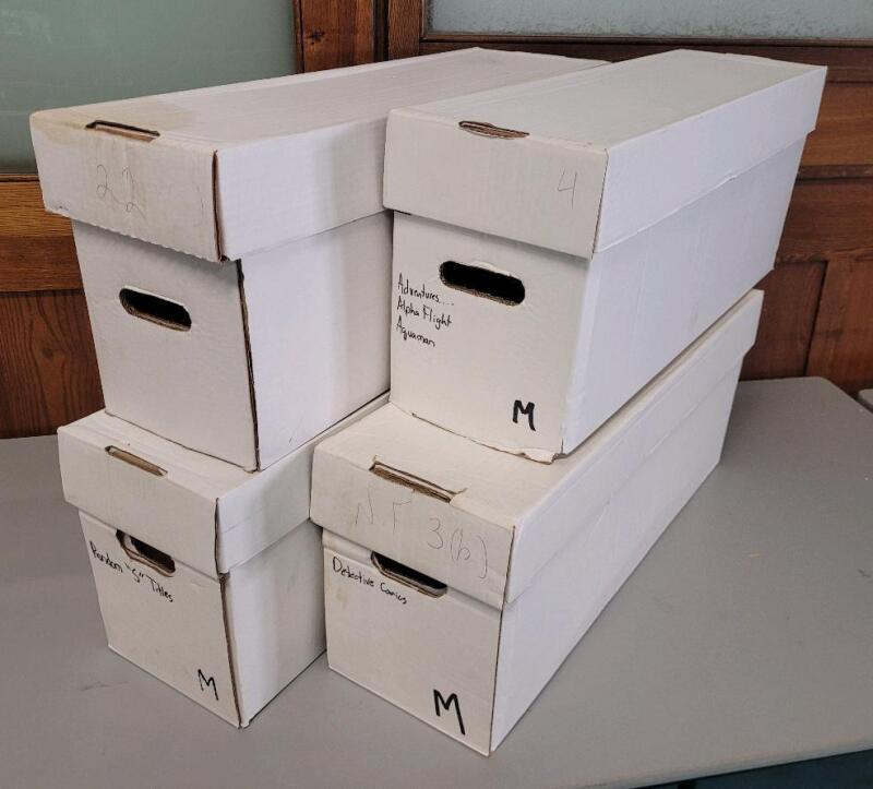 4 Comic Longboxes. Holds 250-300 Comics Each. 27.5" by 8.5" by 11".