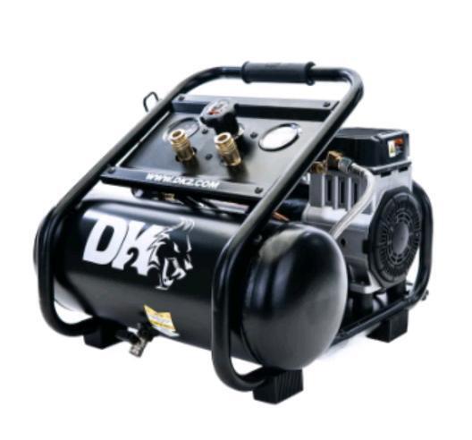 As New - DK2 Twin Cylinder 1-HP 2-Gallon Oil-Free Silent Air Compressor w/DK2 20pc. Air Compressor Accessories Kit . Box has some wear from shipping & storage . Retail $300