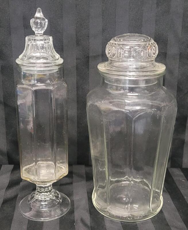Vintage Clear Glass Decorative Jars w/Lids . No visible chips or cracks . Measures 13.5" & 12" Tall