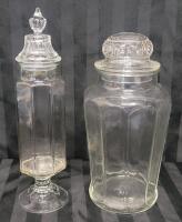 Vintage Clear Glass Decorative Jars w/Lids . No visible chips or cracks . Measures 13.5" & 12" Tall