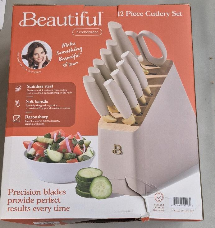 New Beautiful 12 piece Cutlery Set - Includes chef knife, serrated utility knife, serrated santoku knife, paring knife, six steak knives All purpose shears, & wood block retails $79
