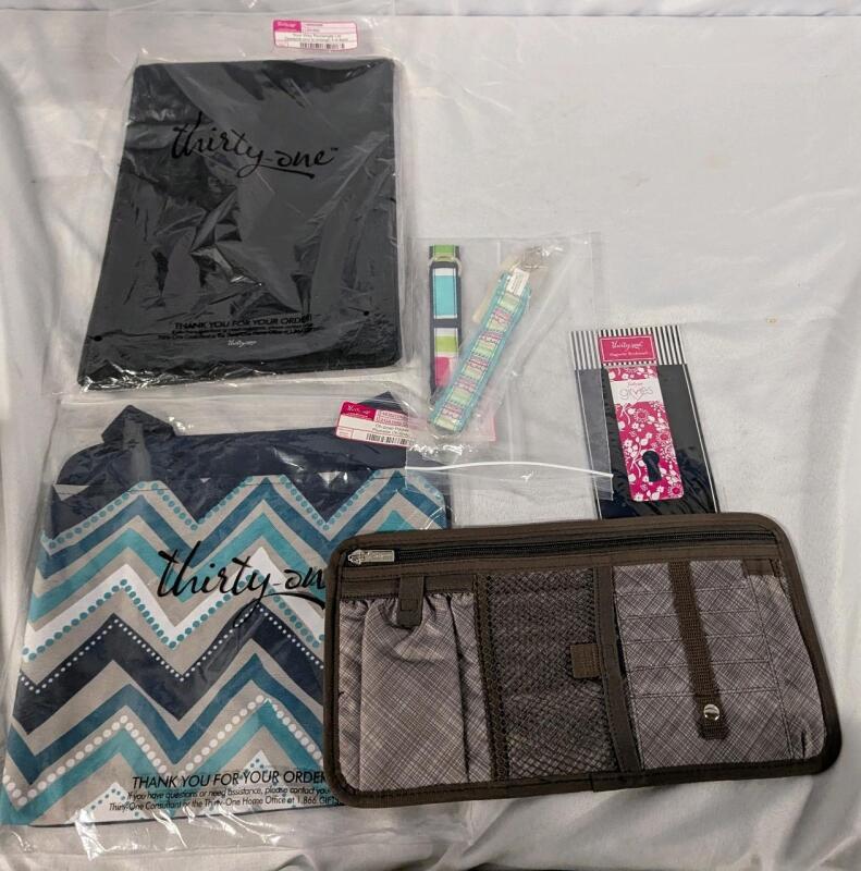 6 New Thirty-One Items. Bookmark, Pocket Organizer, 2 Key Fobs, Rectangle Lid and Oh-Snap Pocket. Organizer is 12.5".