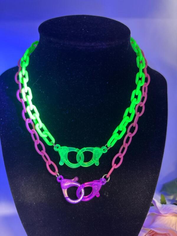 Two Acrylic Handcuff Glowing Retro Fabulous Necklaces One Bright Green One Bright Pink approximately 17 inch