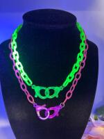 Two Acrylic Handcuff Glowing Retro Fabulous Necklaces One Bright Green One Bright Pink approximately 17 inch