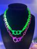 Two Acrylic Handcuff Glowing Retro Fabulous Necklaces One Bright Green One Bright Pink approximately 17 inch