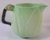 Carlton Ware Apple Bloom Green Jug & Creamer . Measures 5" & 3.5" tall . Creamer has crack on handle - 3