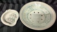 2 Ceramic Dishes. 1 Berry Bowl and 1 Spoon Rest. Artists Signature on Bottom. Berry Bowl Measures 9" Across.
