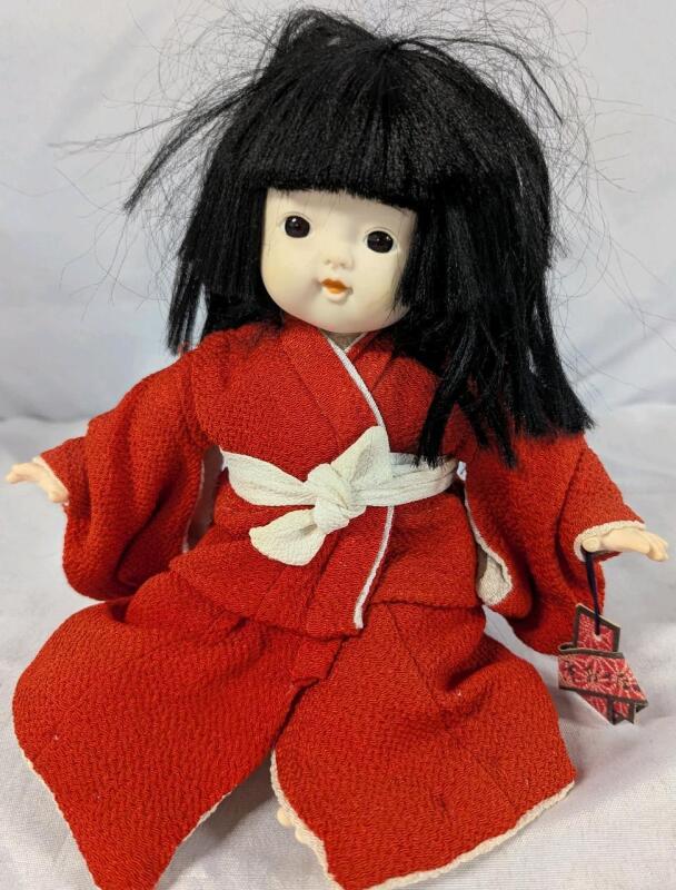Vintage Japanese Girl Doll in Red Kimono With Stand. Measures 7" Tall