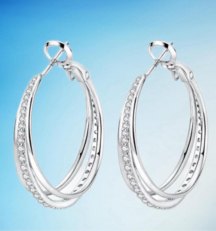 Marked 925 Sterling Sparkling Three Band Hoop Earrings Centre Hoop Clear Stones Omega clasp Approximately 1&rsquo;&rsquo;