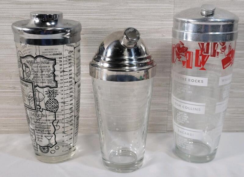 Three (3) Cocktail Drink Mixers . 2 with Drink Ingredients . Measures 8.5" to 9 &frac34;" tall .