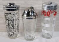 Three (3) Cocktail Drink Mixers . 2 with Drink Ingredients . Measures 8.5" to 9 &frac34;" tall .