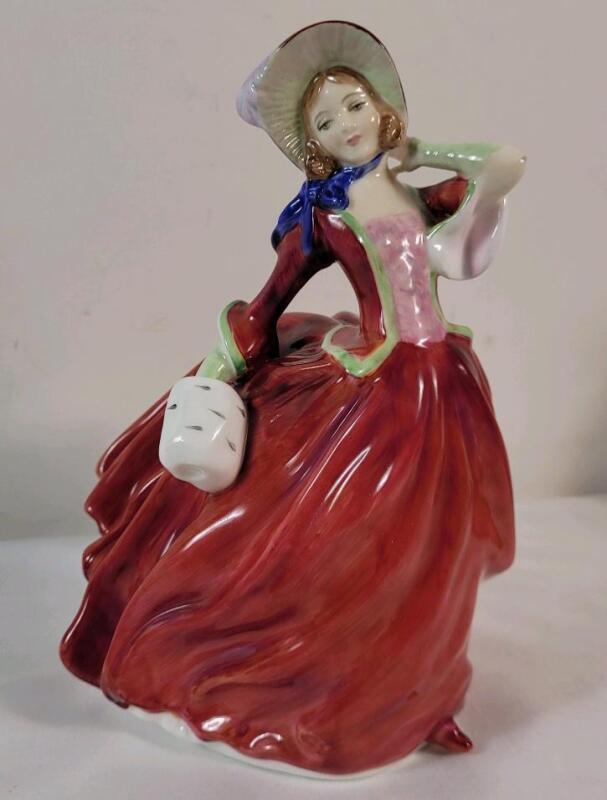 Royal Doulton " Autumn Breezes " Figurine , HN 1934 . Measures 7 &frac34;" tall . No chips or cracks . Minor wear to elbow .