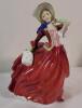 Royal Doulton " Autumn Breezes " Figurine , HN 1934 . Measures 7 &frac34;" tall . No chips or cracks . Minor wear to elbow .